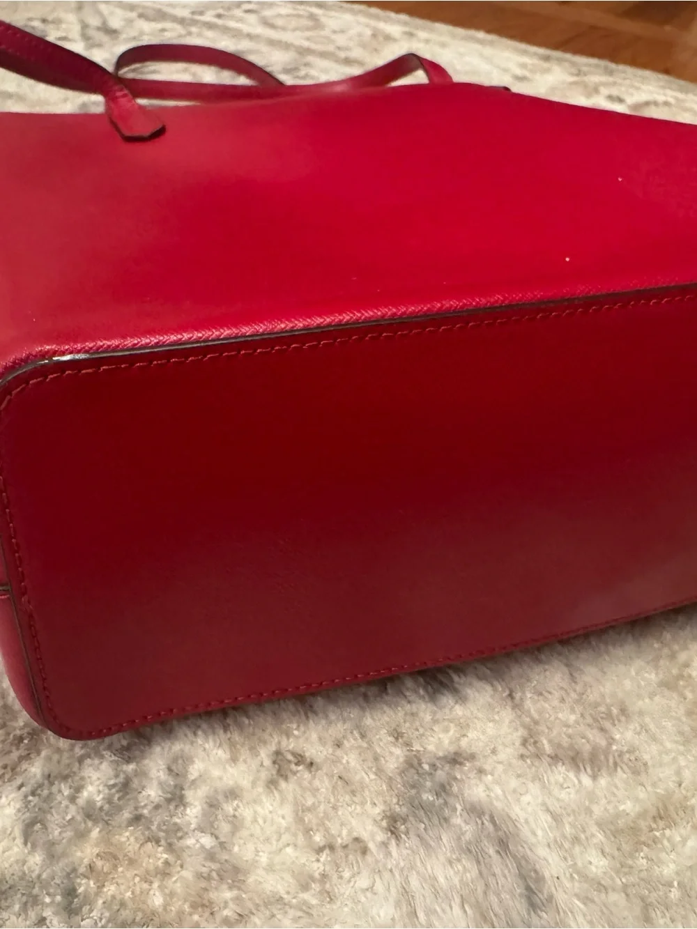 kate spade red Saffiano leather tote with tassel charm